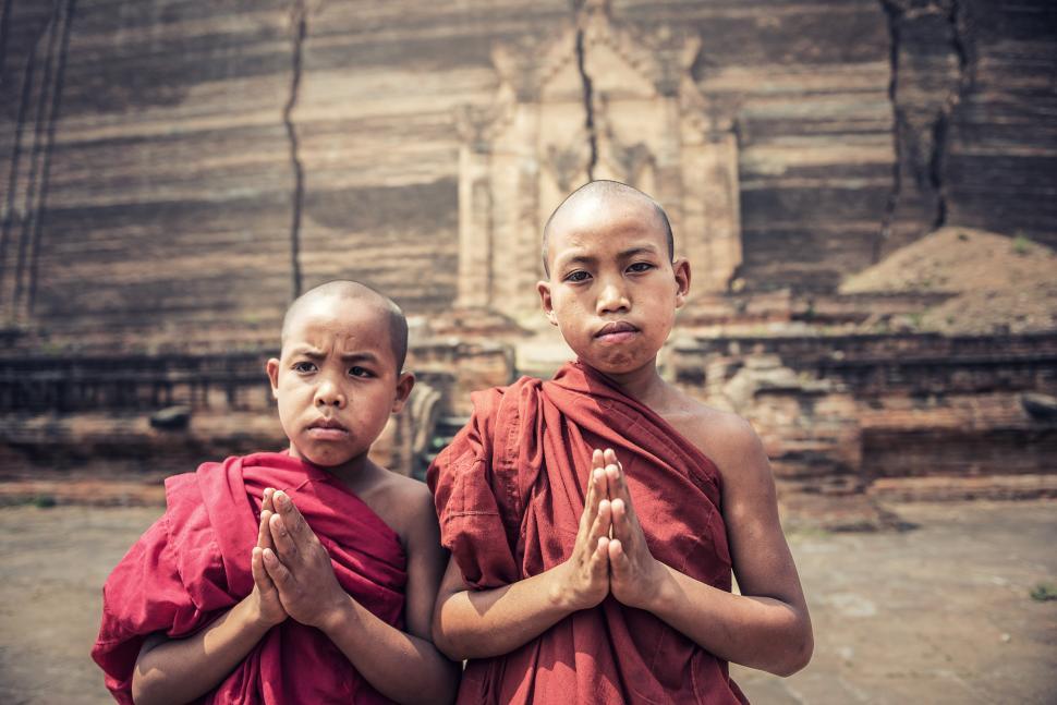 Free Image of Two Young Monks Standing Next to Each Other 
