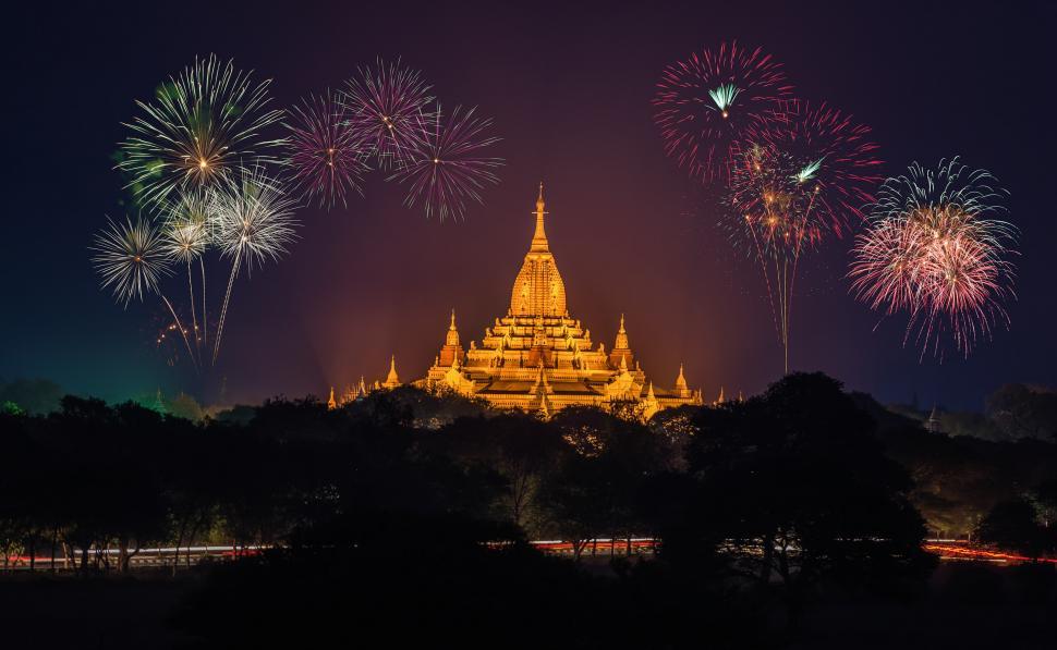 Free Image of Fireworks Illuminate Night Sky Above Temple 