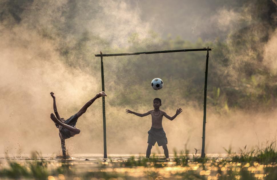 Free Image of People Playing Soccer Together 