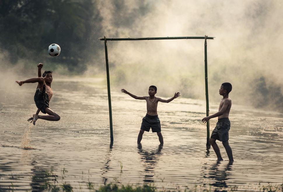 Free Image of Young Men Playing a Game of Soccer 
