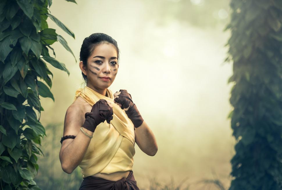 Free Image of Woman in Yellow Shirt and Black Gloves 