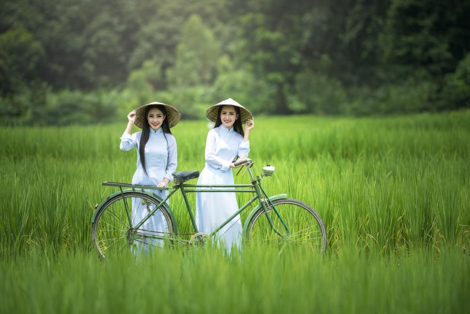 Free Image of Two Girls with Bicycle 
