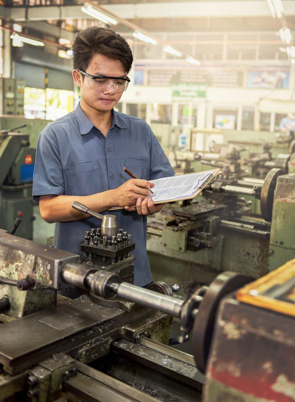 Free Image of Man Operating Machine in Factory 