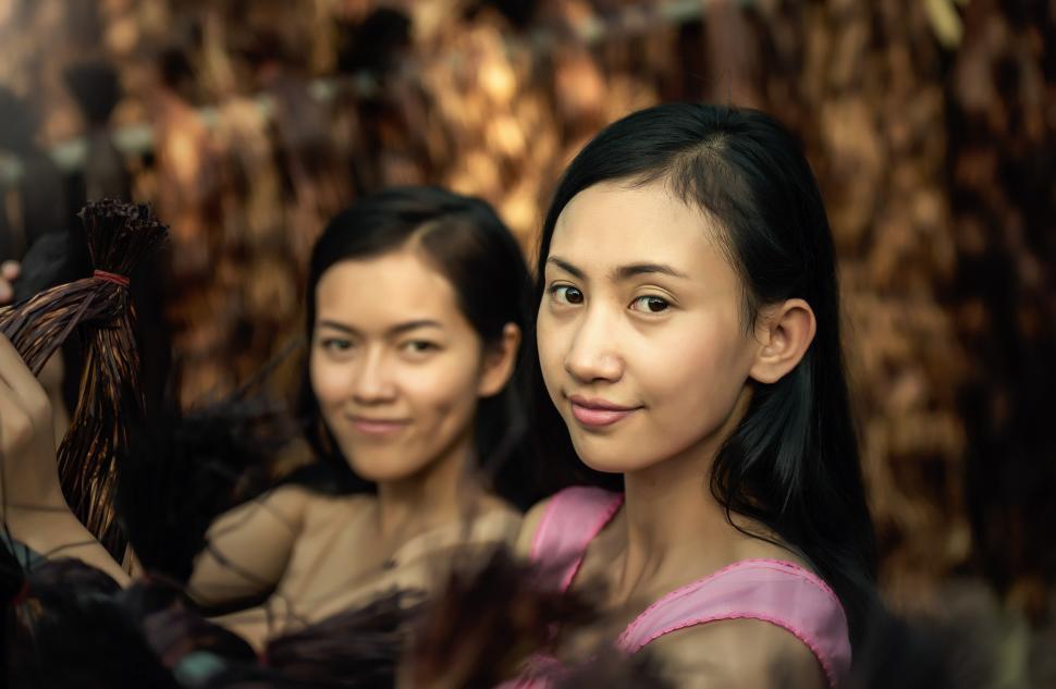 Free Image of Two Young Women Standing Together 