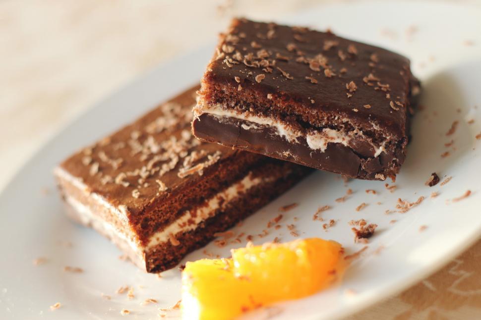 Free Image of White Plate With Two Pieces of Chocolate Cake 