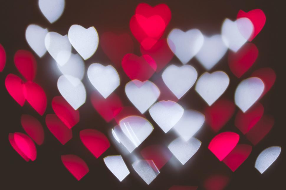 Free Image of White and Red Hearts on Black Background 