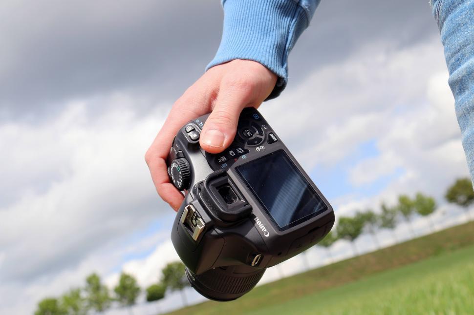 Free Image of Person Holding Camera 