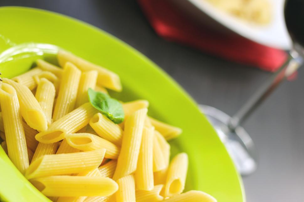 Free Image of Green Bowl Filled With Pasta on Table 