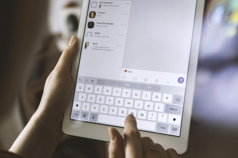 Free Image of Person Holding Tablet With Keyboard 