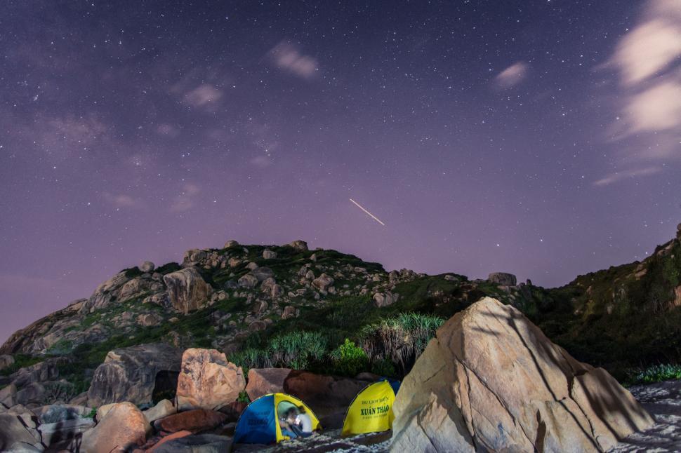 Free Image of Tents on Rocks Under Night Sky 