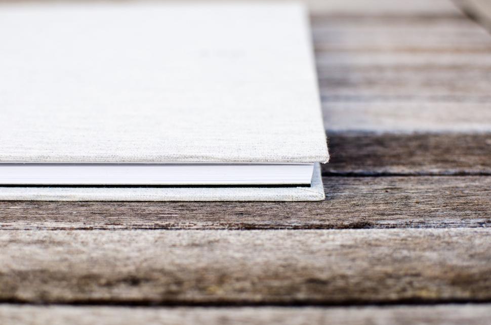 Free Image of White Book on Wooden Table 