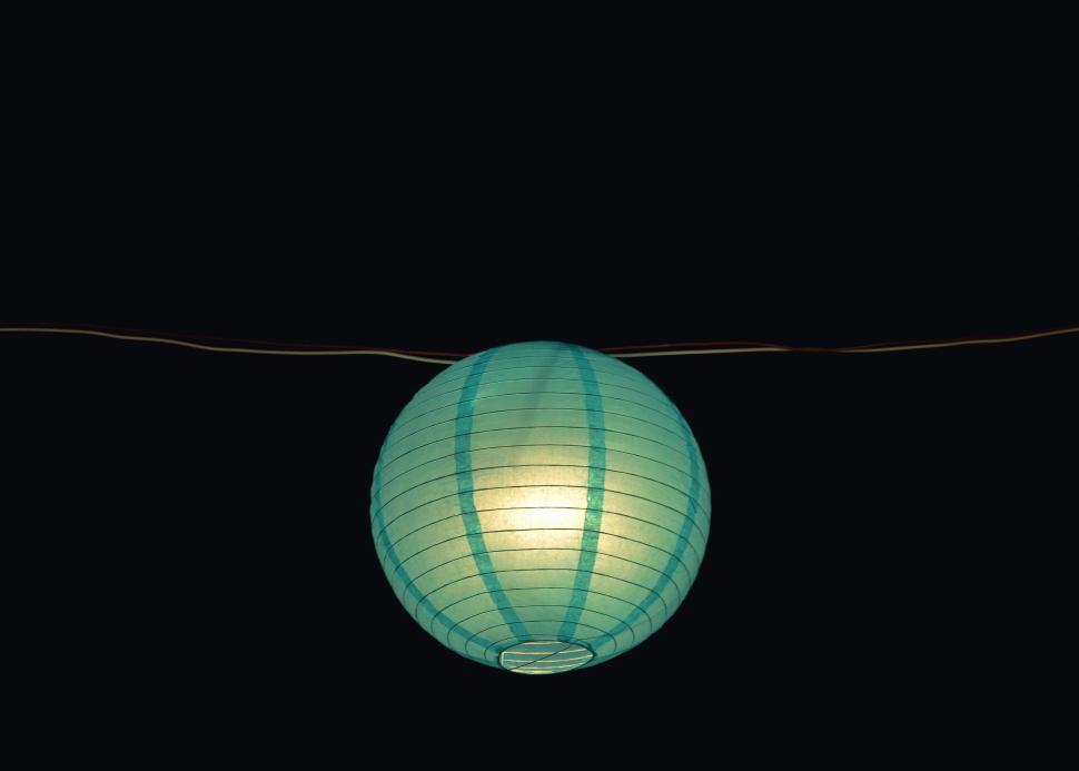 Free Image of Light Bulb Hanging on Wire in Darkness 