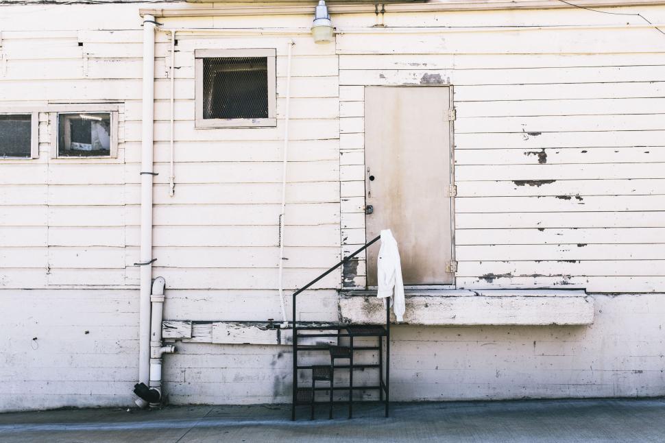 Free Image of White Building With Door and Window 