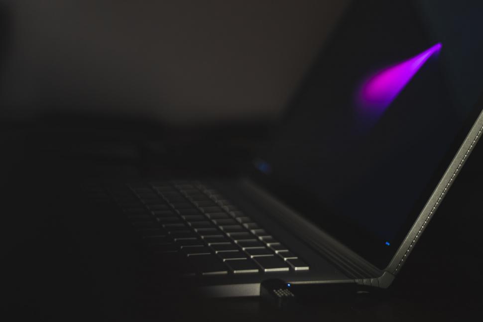 Free Image of Close Up of Laptop With Purple Light 