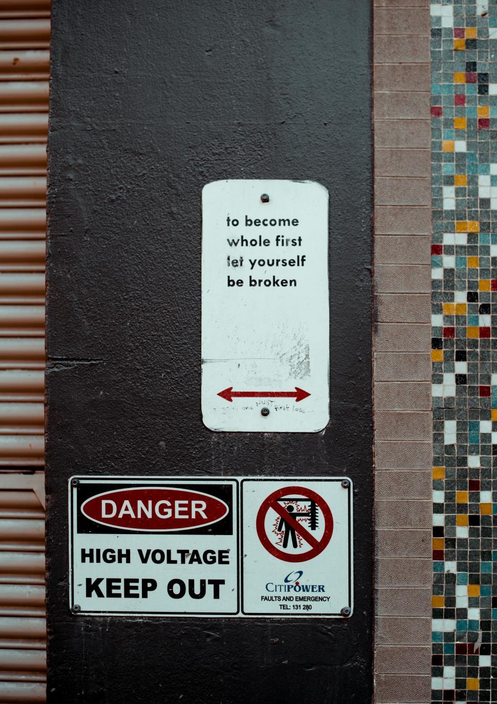 Free Image of Danger High Voltage Keep Out Sign on Building 