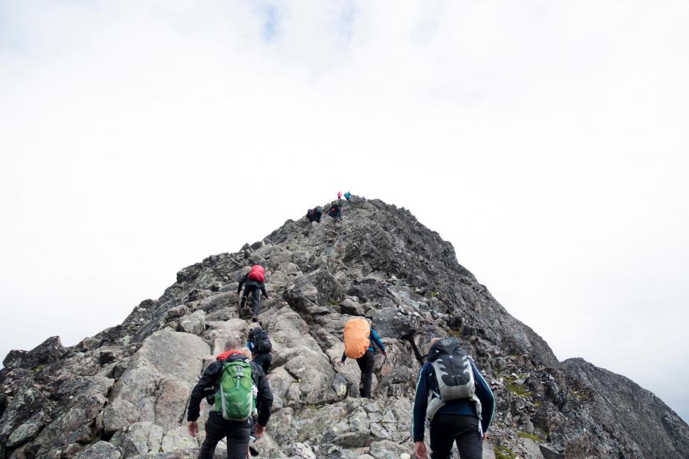 Free Image of Group of People Climbing Up Mountain 