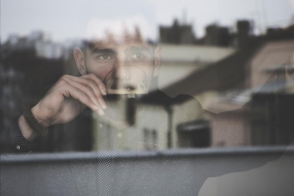 Free Image of Mans Reflection in Window 