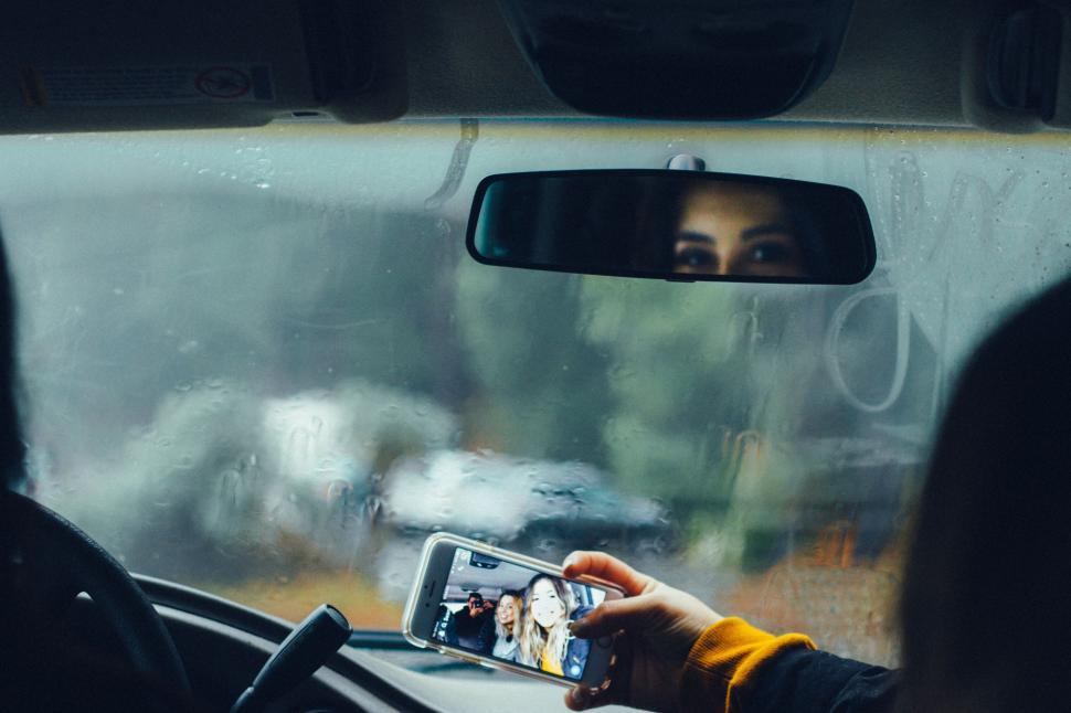 Free Image of Person Taking Selfie in Car 
