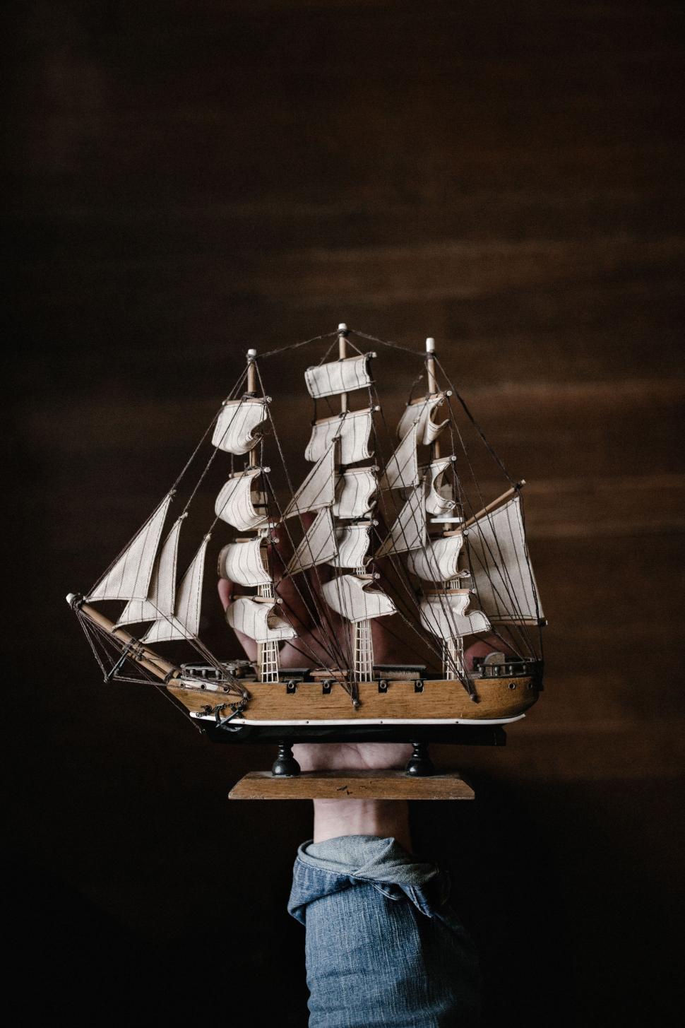 Free Image of Model Sailing Ship on Wooden Stand 