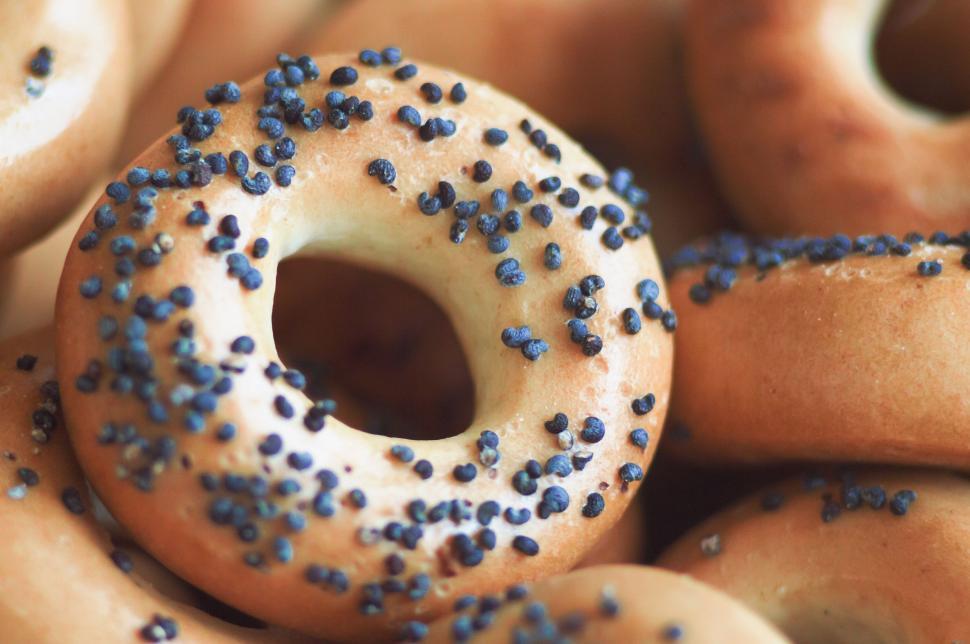 Free Image of A Pile of Doughnuts With Blue Sprinkles 