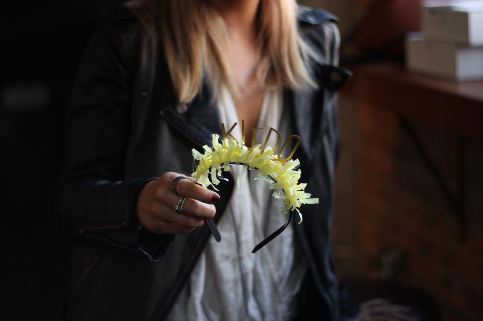 Free Image of Woman Holding Flower in Hand 