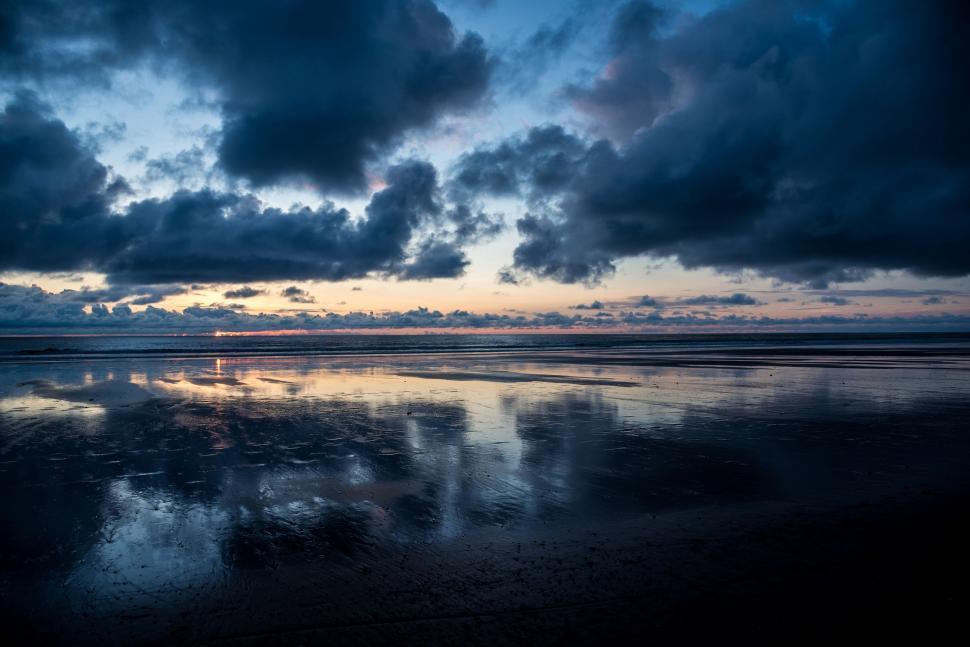 Free Image of Sky Reflecting in Wet Sand 