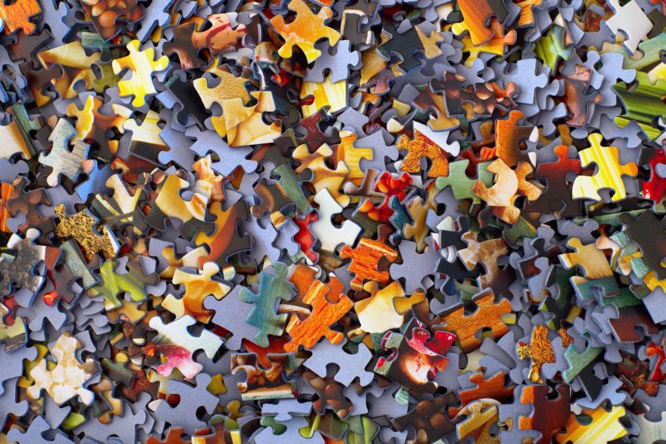 Free Image of A Pile of Different Colored Puzzle Pieces 