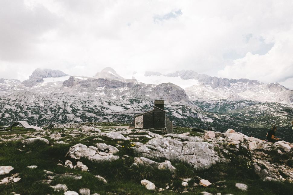 Free Image of House Amidst Mountain Peaks 