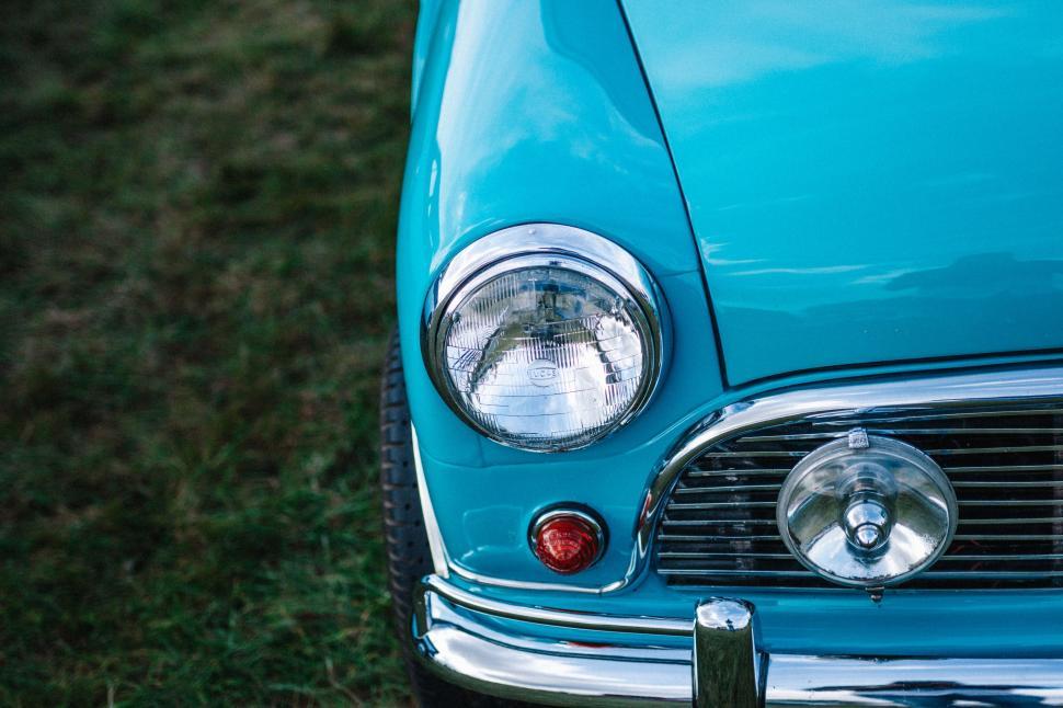 Free Image of Close Up of the Front of a Blue Car 