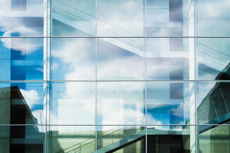 Free Image of Reflection of a Building in a Glass Wall 