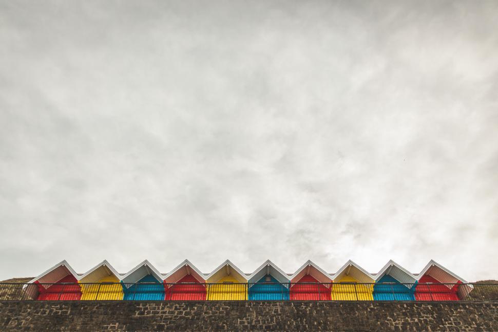 Free Image of Colorful Umbrellas on Brick Wall 