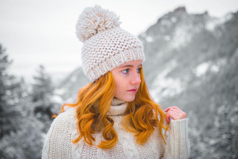 Free Image of Red-Haired Woman in White Hat and Scarf 