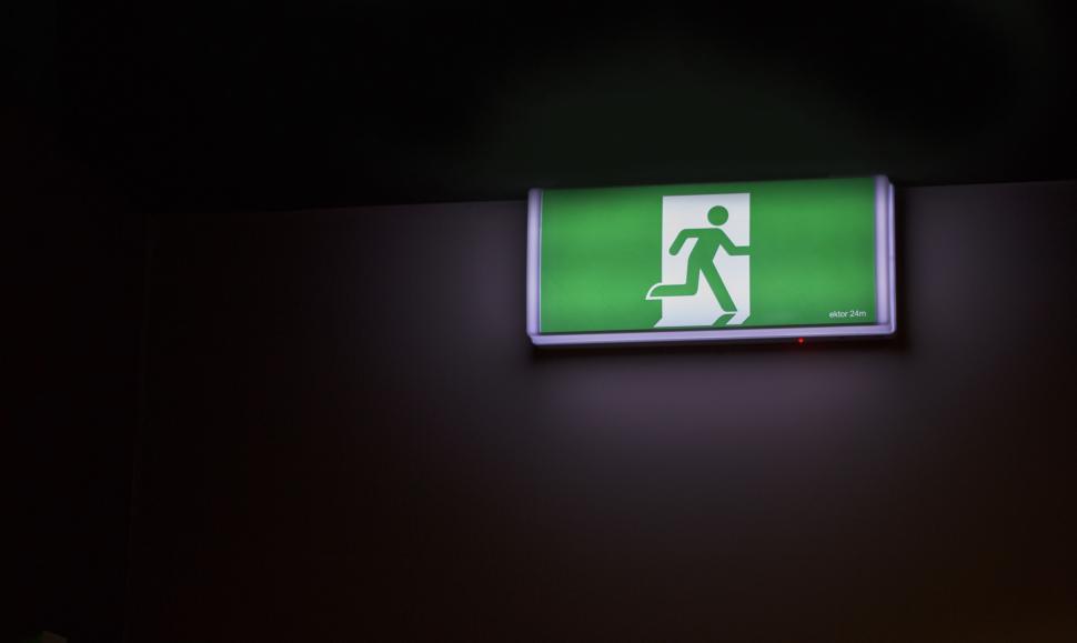 Free Image of Green and White Sign on Black Wall 