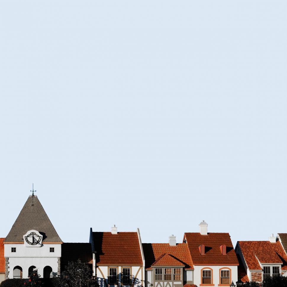 Free Image of Row of Houses With Clock Tower 