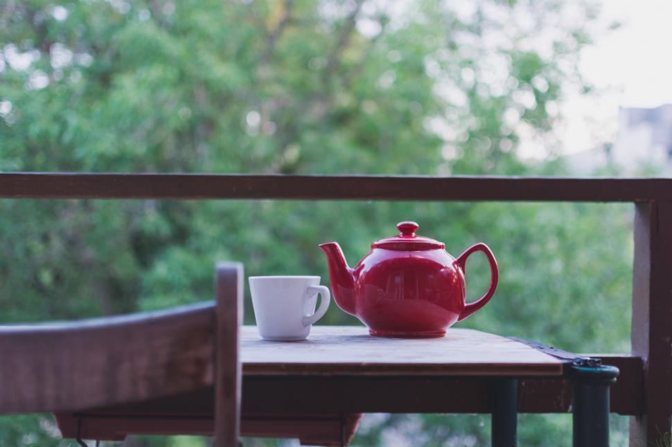 Free Image of Red Teapot on Wooden Table 