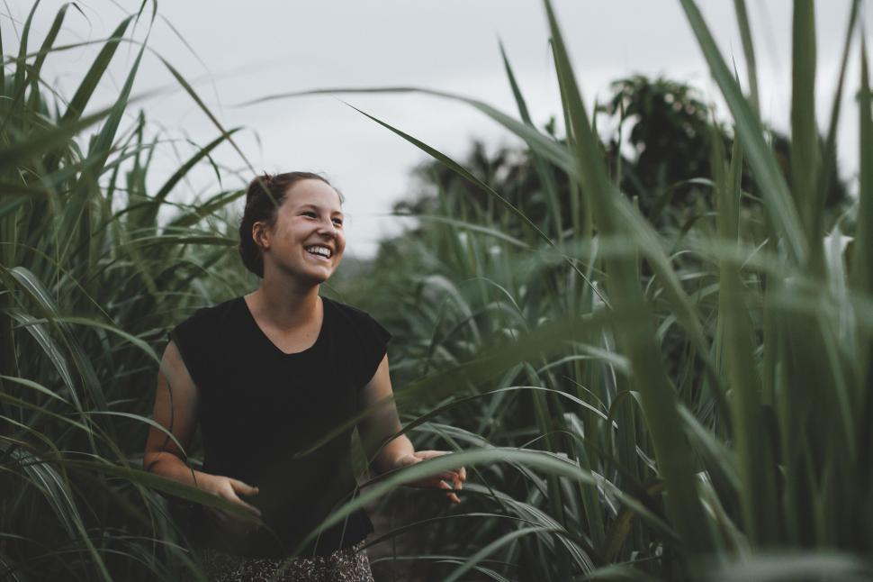 Free Image of Woman Standing in Tall Grass Field 