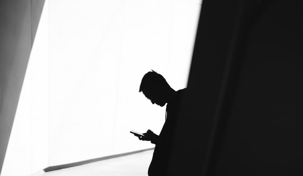 Free Image of Person Using Cell Phone Silhouette 