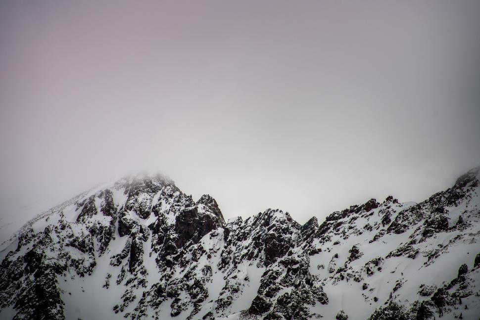 Free Image of Snowboarder Descending Snowy Mountain 