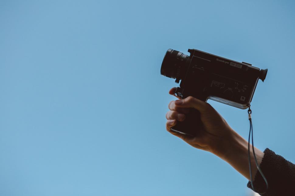 Free Image of Person Holding Camera Up in the Air 