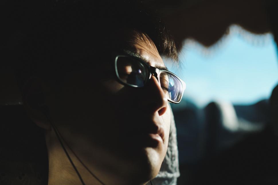 Free Image of Man Wearing Glasses Sitting in Car 