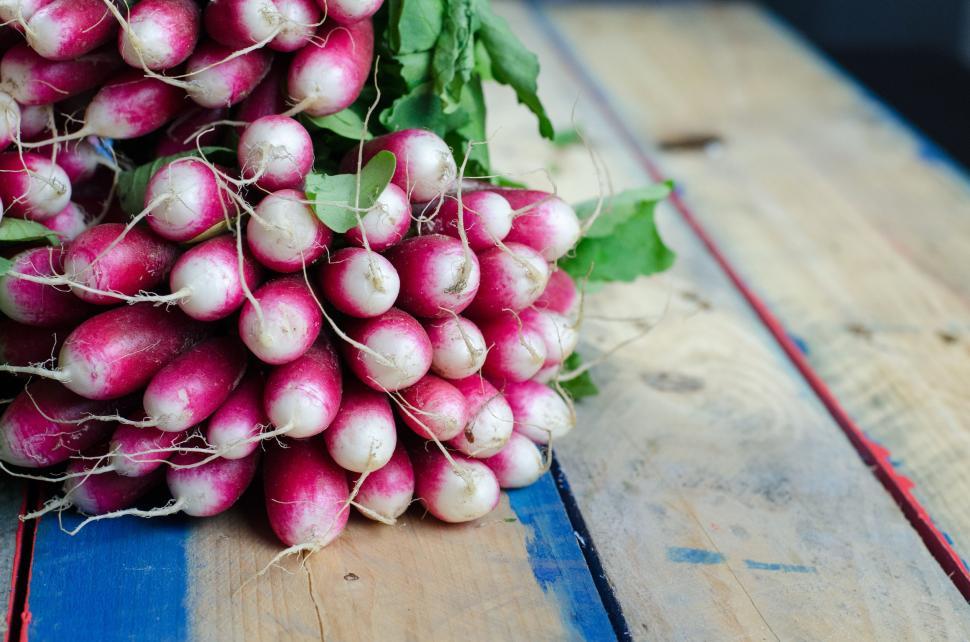 Free Image of A Bunch of Radishes on a Wooden Table 
