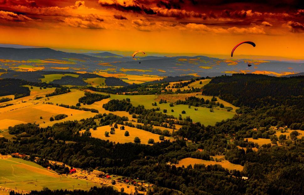 Free Image of Sunset Over Valley With Hot Air Balloons 