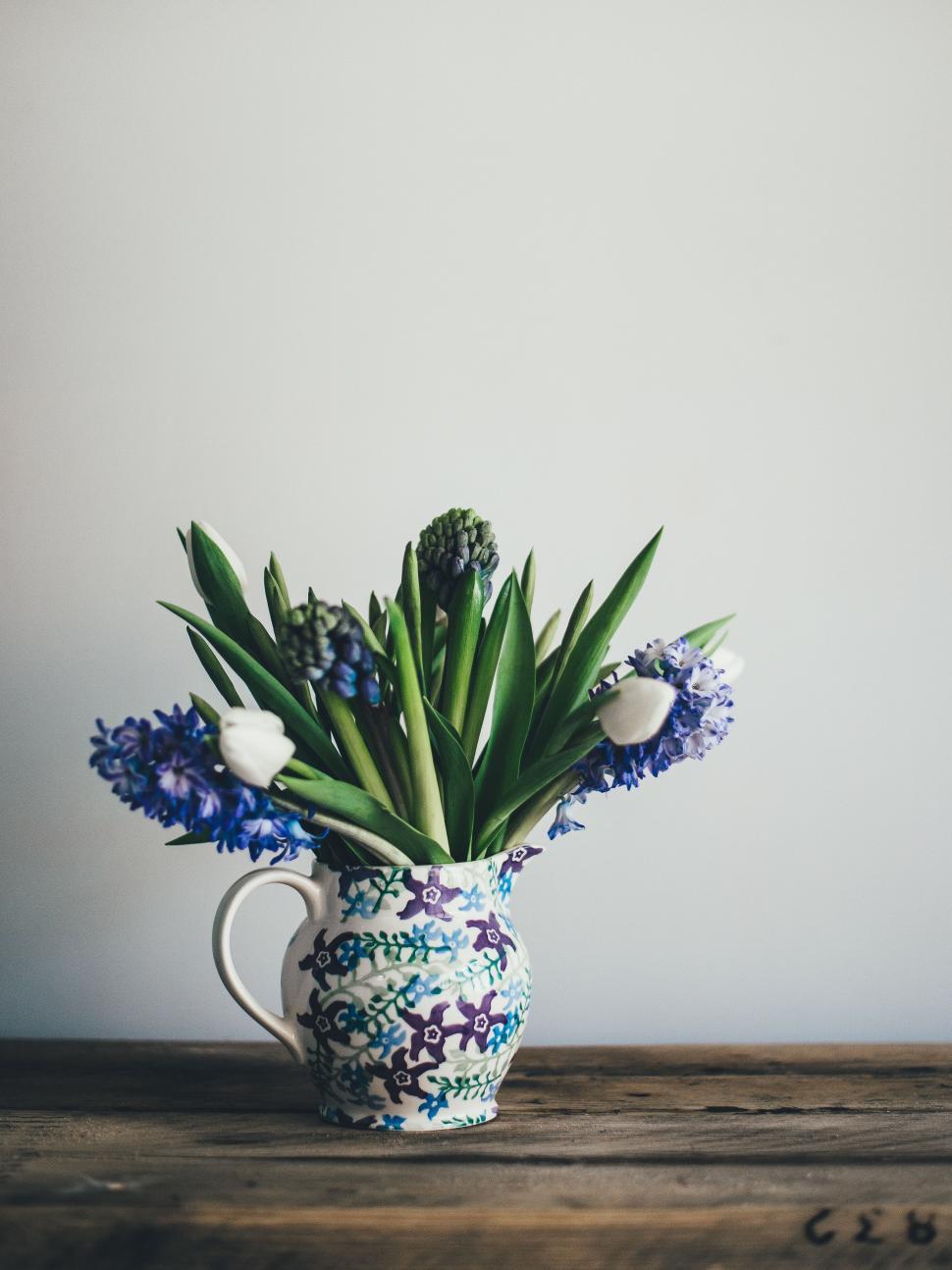 Free Image of Blue and White Vase With Flowers 