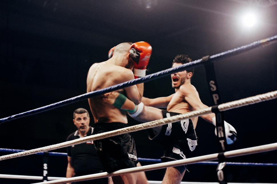 Free Image of Two Men Boxing in a Boxing Ring 