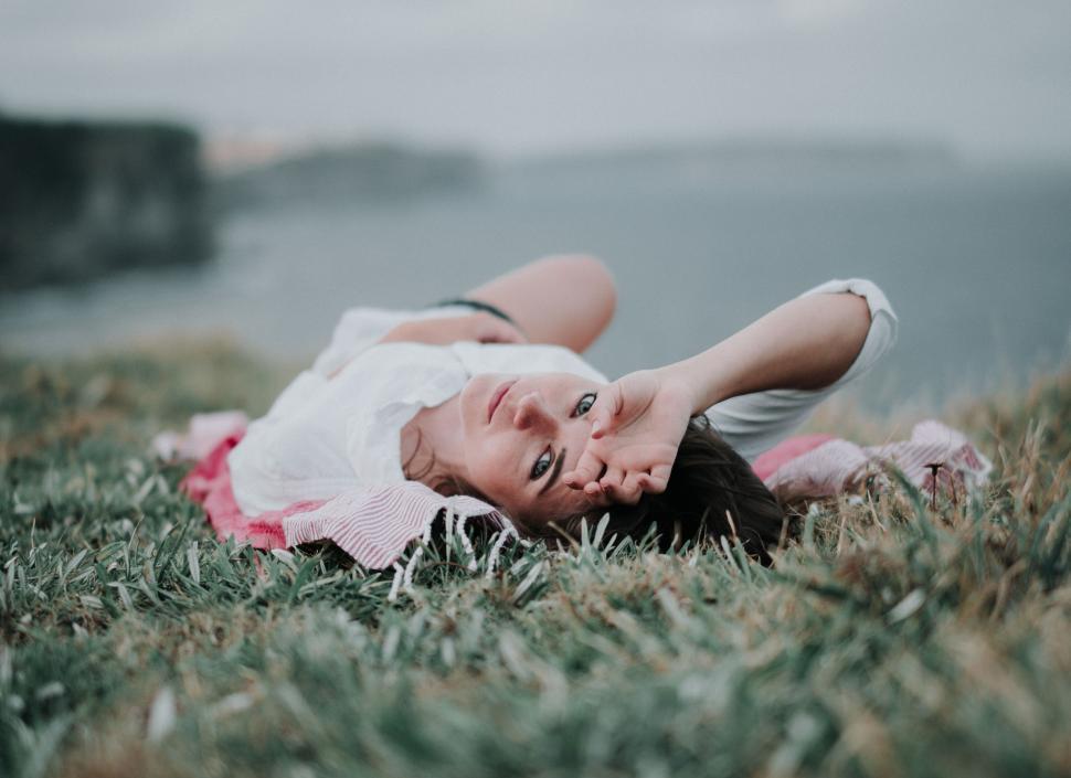 Free Image of Woman Laying in Grass 