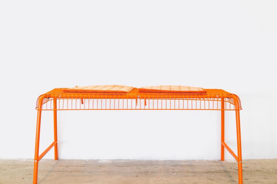 Free Image of Orange Table With Two Trays 