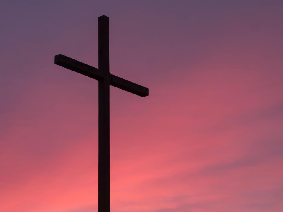 Free Image of Silhouetted Cross Against Pink Sky 