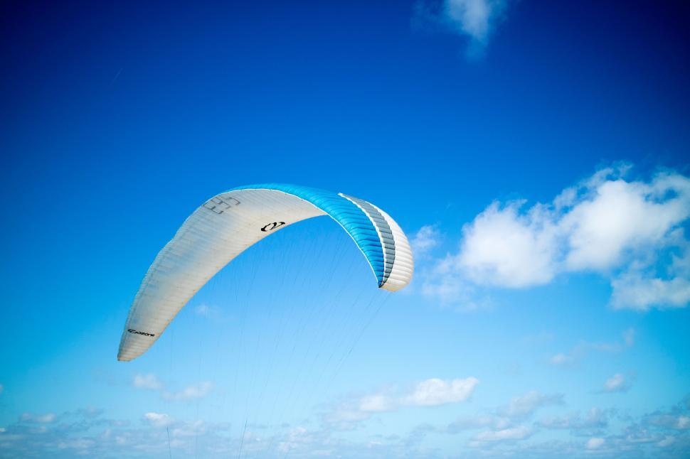 Free Image of Person Para Sailing on Ocean Under Blue Sky 