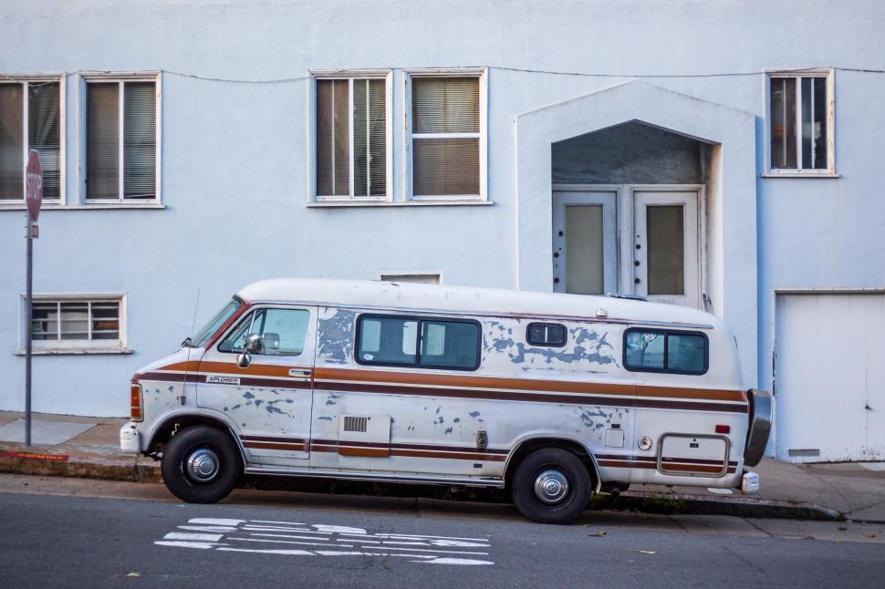 Free Image of Old Van Parked in Front of White Building 