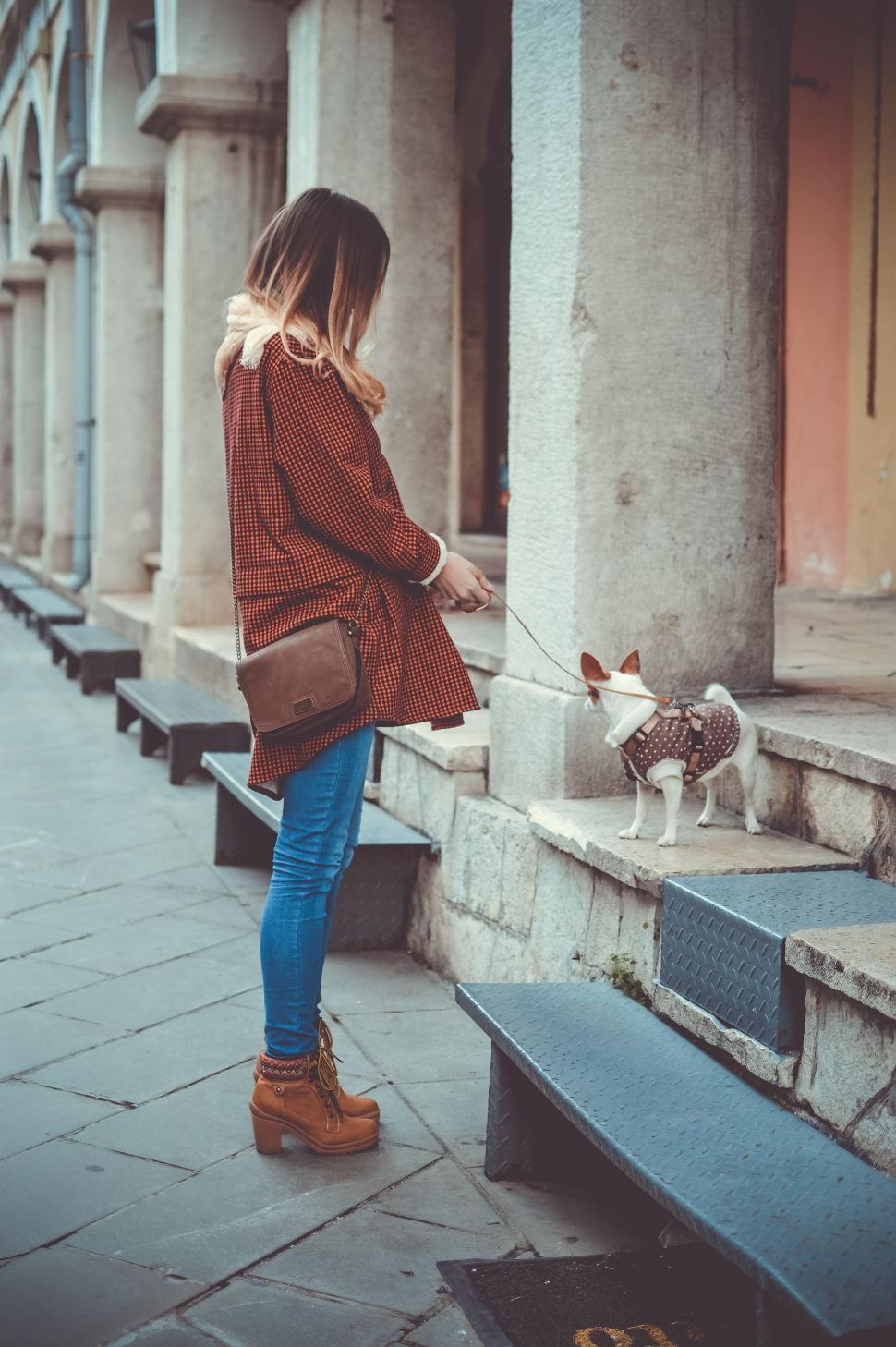 Free Image of Woman Walking Small Dog on Leash 